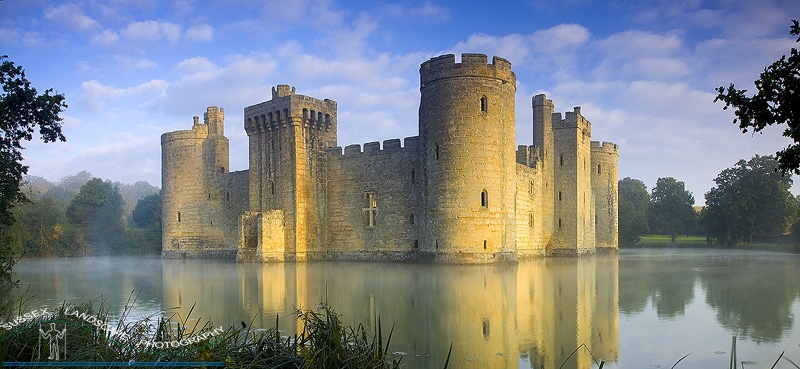 slides/Dawn on Bodiam.jpg bodiam castle east sussex castle moat building dawn sunlight mist panoramic trees clouds blue sky lake water reflections turrets ancient Dawn on Bodiam